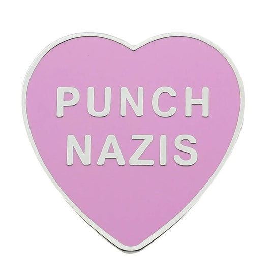 Heart-shaped pink enamel pin with 'PUNCH NAZIS' text 