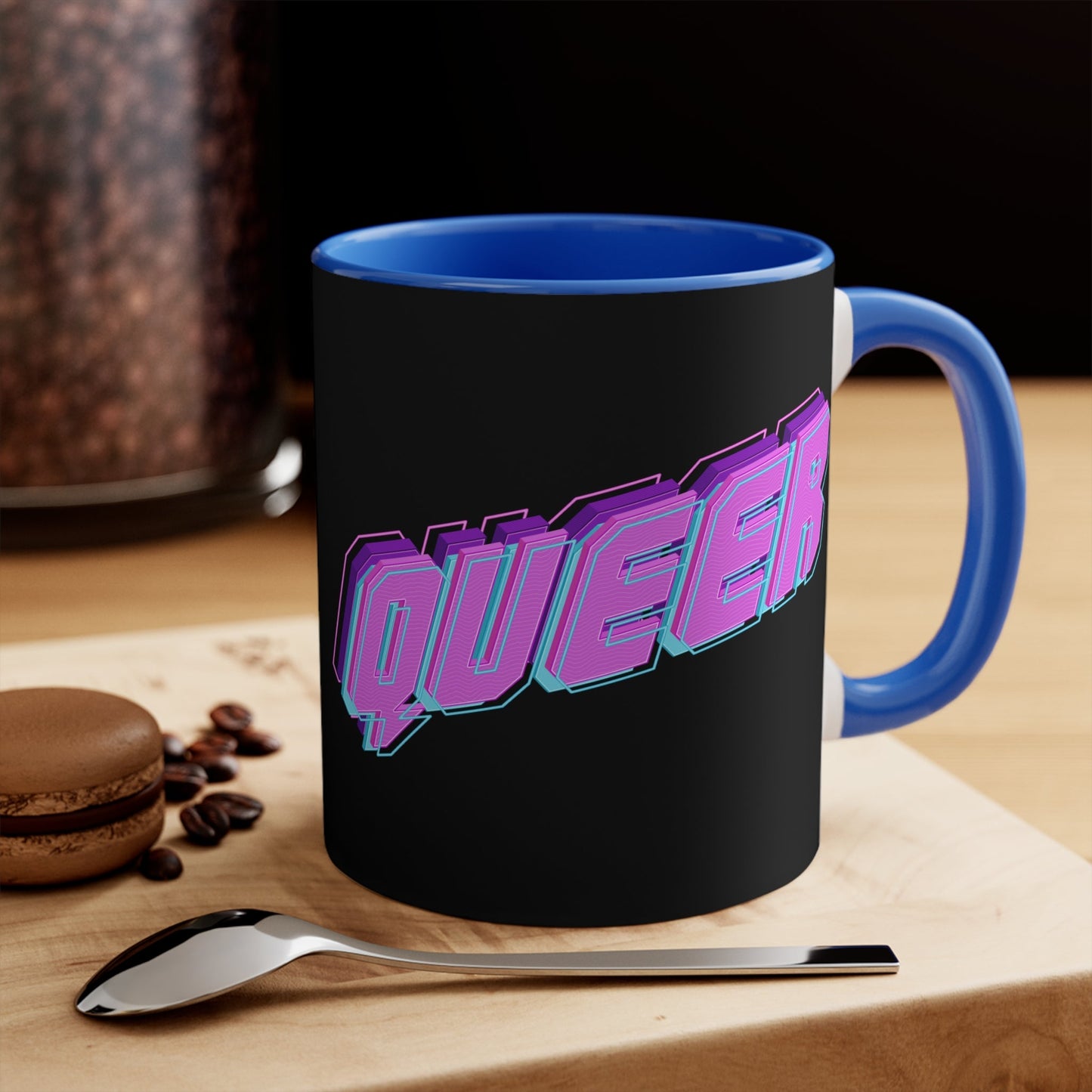 Introducing the "QUEER vibrant neon text - colourful accent mug": a striking black mug with "QUEER" boldly displayed in vibrant neon purple and blue 3D letters, set against the dark background. The captivating design is original and the perfect pride gift