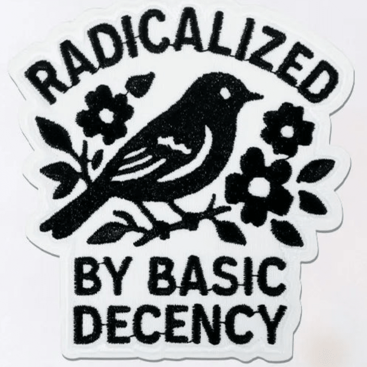 Embroidered Patch with a black bird and flowers design and text 'RADICALIZED BY BASIC DECENCY' on a white background.