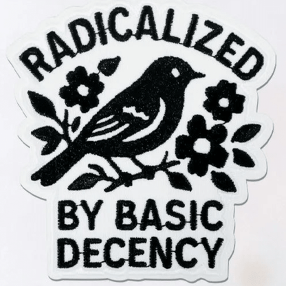 Embroidered Patch with a black bird and flowers design and text 'RADICALIZED BY BASIC DECENCY' on a white background.