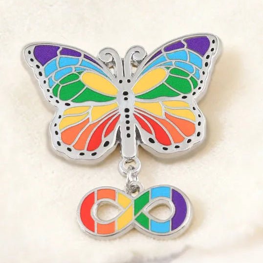 Colorful butterfly-shaped pin with an infinity symbol. Neuroqueer pride