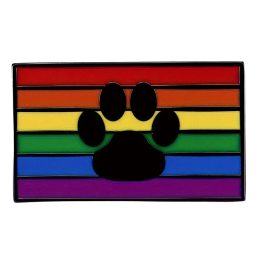 The Rainbow Paw Print Enamel Pin is a durable rectangular pin with horizontal rainbow stripes and a central black paw print, celebrating LGBTQ+ pride and pup pride through its vibrant design. Puppy play, bdsm, leather pride.