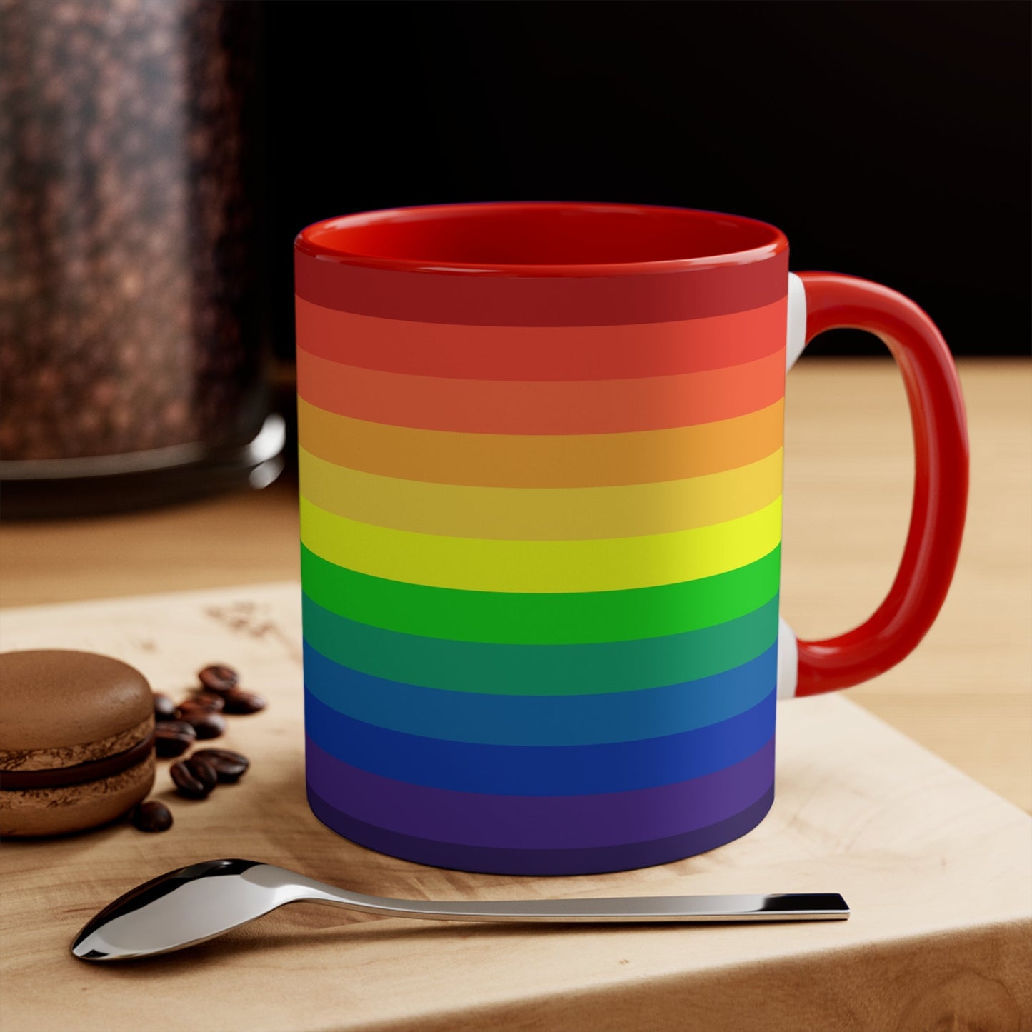 A Rainbow Pride Flag Gradient Colorful Accent Mug by Printify features a white coffee mug with a red handle, showcasing a vertical rainbow gradient design. The colors transition smoothly from red at the top to purple at the bottom, symbolizing LGBTQ+ pride. This eye-catching color contrast is enhanced by the solid red interior and completed with a plain white background.