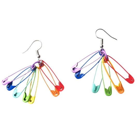 Rainbow Safety Pin Earrings by Gay Skate blend emo punk style safety pins into a vibrant fan shape, featuring a rainbow pride flaf from purple to red, elegantly hanging from silver hooks