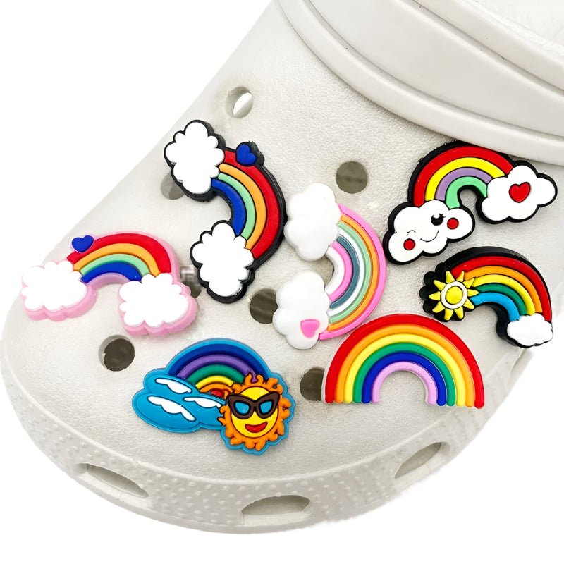 Rainbow Jibbitz for Crocs LGBTIQAP+ Pride shoe charms: rainbows, clouds, a sun with sunglasses, and a heart. These vibrant accessories infuse Gay Pride into your footwear.