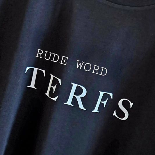 A locally printed black crop tee with bold white "TERFS" text, handmade by a queer-owned small business.