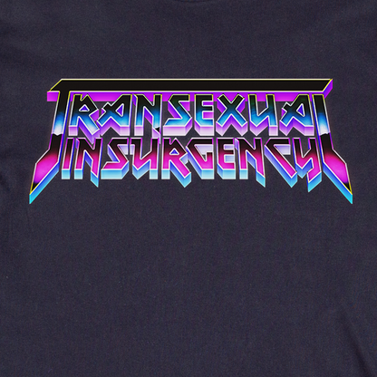 The image displays "Transexual Insurgency" in bold, angular, purple and blue gradient metallic letters on a dark backdrop, as featured on the locally hand printed Transexual Insurgency t-shirt.