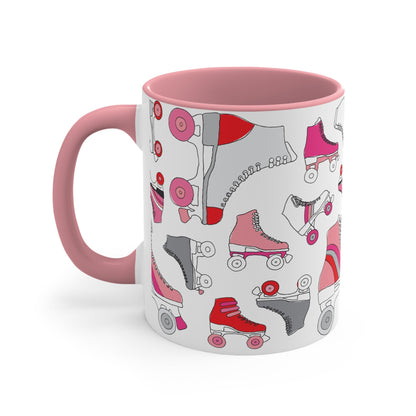 The Roller Skate cup from Printify is a white ceramic mug featuring a vibrant pattern of pink, red, and gray quad skates. The mug also highlights a red handle and interior that complement its playful design.