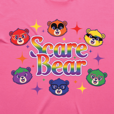 Colorful six bear faces with unique styles, rainbow "Scare Bear" text, and sparkling stars on pink make the SCARE BEAR fundraiser tee a perfect choice for fans of roller derby shirt styles and GAY SKATE vibes. Locally hand printed t-shirt.