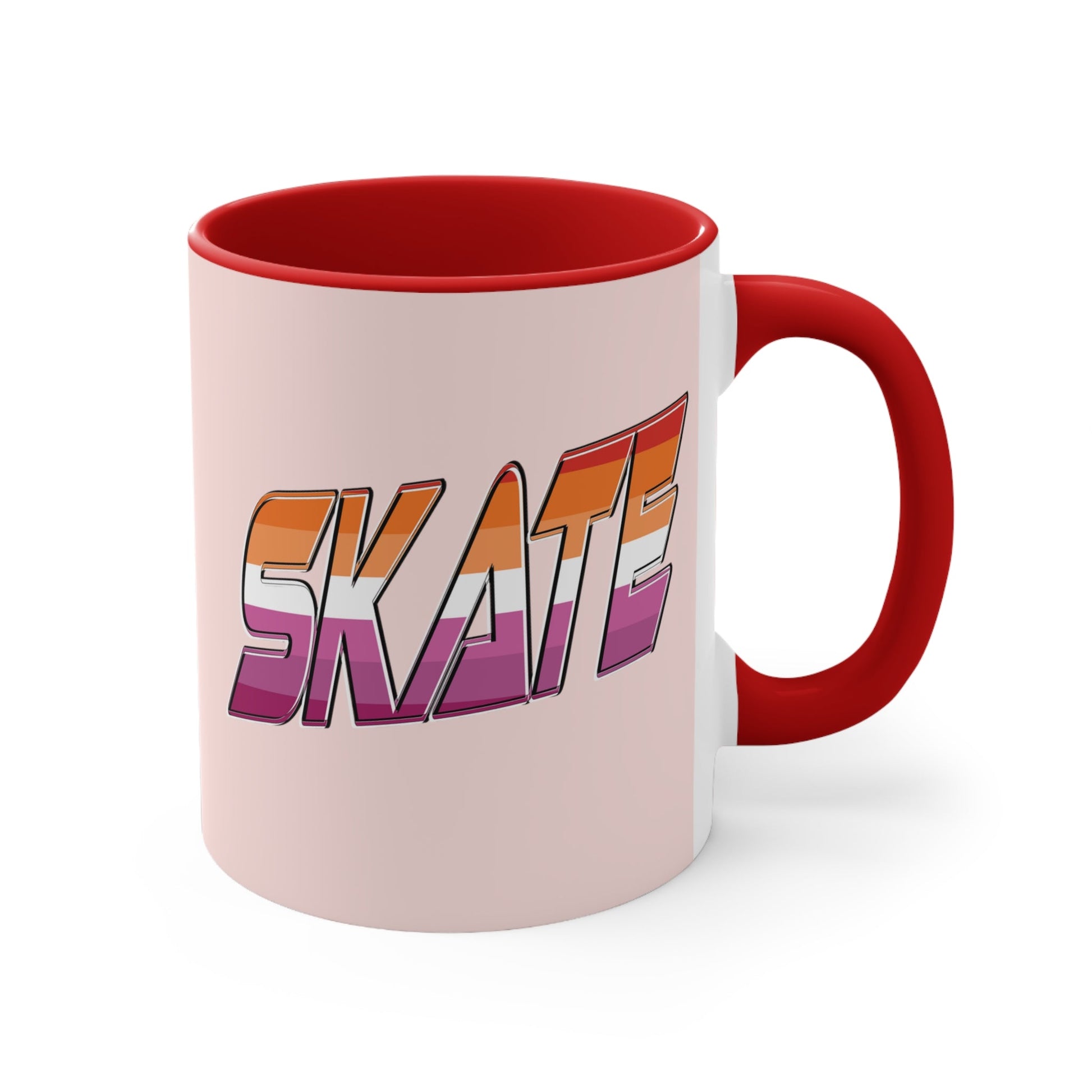 The SKATE lesbian pride flag accent mug by Printify features a bold "SKATE" design in gradient colors of orange, pink, and purple. This eye-catching ceramic mug boasts a light pink handle and interior that beautifully contrast with its pale pink exterior.