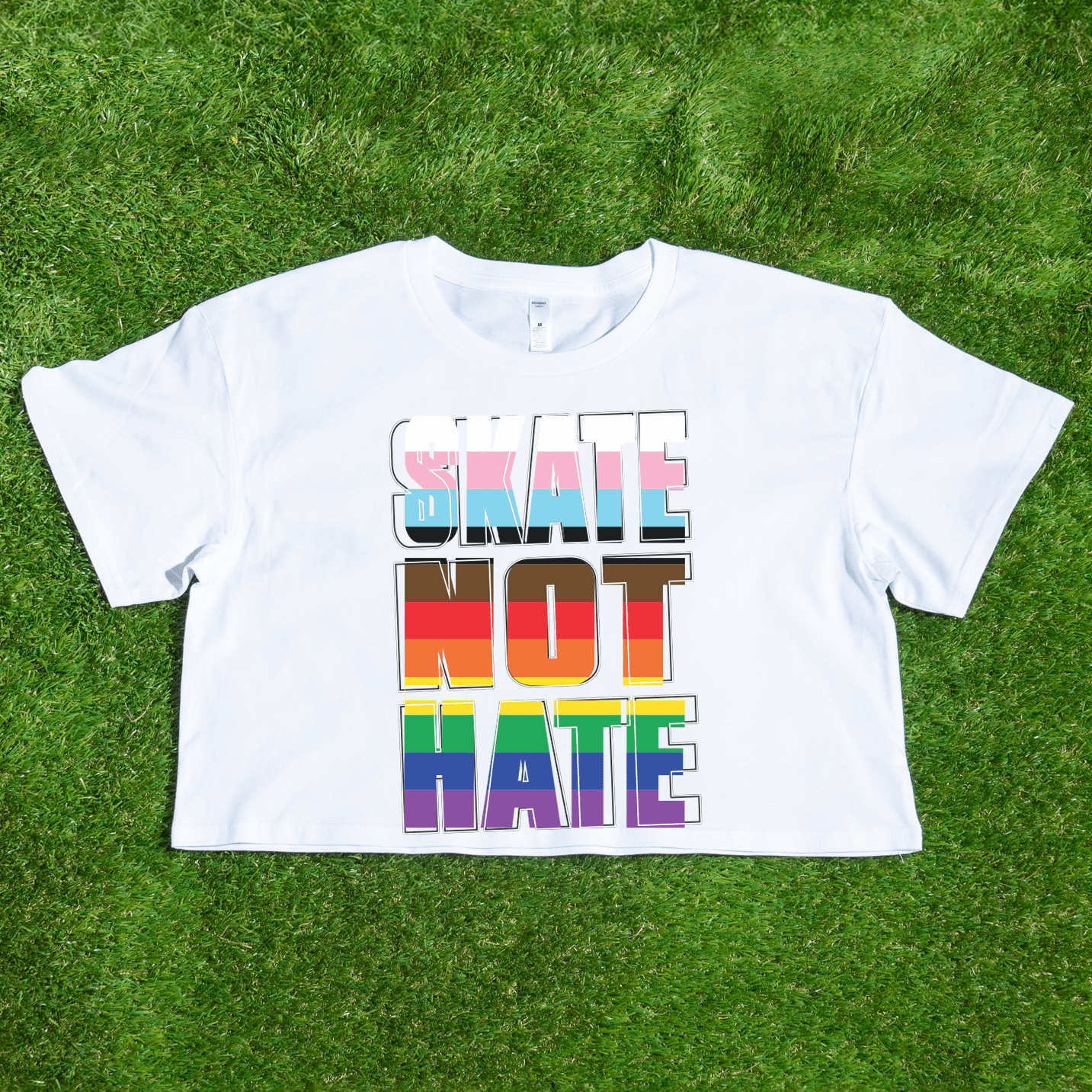 White AS Colour WO Crop t-shirt with 'SKATE NOT HATE' text in inclusive rainbow pride flag colours
