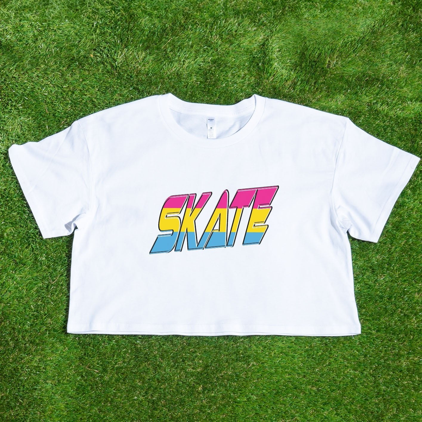 The TRANS RIGHTS original design - locally printed crop tee by Gay Skate is a black cropped T-shirt featuring a vibrant graphic in the center with bold, stylized text reading "TRANS RIGHTS." The design incorporates pastel shades and a lightning bolt motif above the text, celebrating transgender pride.