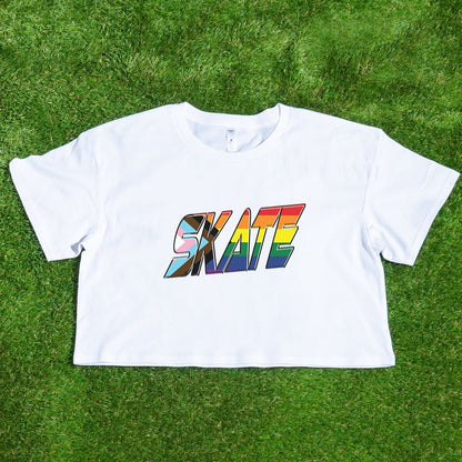 Introducing the "SKATE" progress pride rainbow flag locally printed crop tee by Gay Skate – a stunning black short-sleeve cropped t-shirt that proudly displays "SKATE" in large, bold letters across the chest. The vibrant font features a colorful, diagonal rainbow gradient, capturing the spirit of queer skatewear and celebrating individuality and pride.