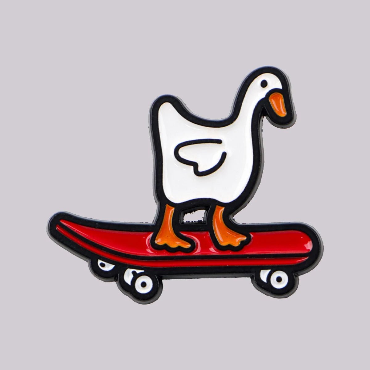 Enamel pin of a goose on a red skateboard 