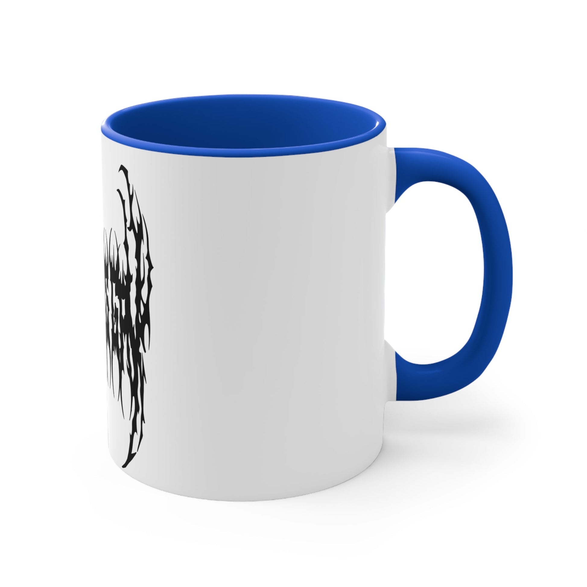 The "SKATING IS GAY but make it death metal accent mug" by Printify is a white mug with a black interior featuring an intricate design that resembles sharp, thorny text. Styled in a death metal font, the symmetrical design has an aggressive, edgy appearance that makes the text difficult to read due to its complex, spiky style.