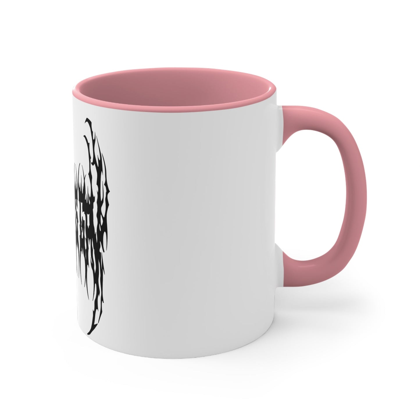 The "SKATING IS GAY but make it death metal accent mug" by Printify is a white mug with a black interior featuring an intricate design that resembles sharp, thorny text. Styled in a death metal font, the symmetrical design has an aggressive, edgy appearance that makes the text difficult to read due to its complex, spiky style.