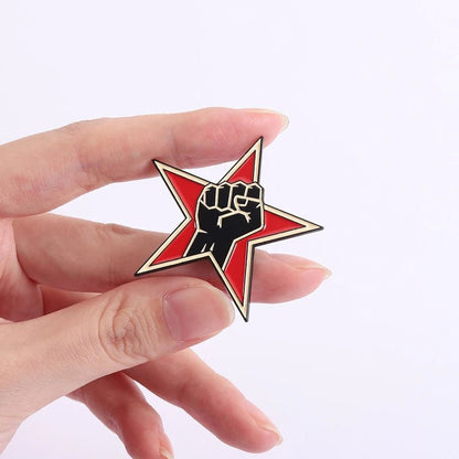 Red star with a black fist solidarity resistance antifa badge