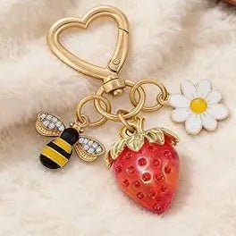 Keychain with strawberry, bee, and flower charm