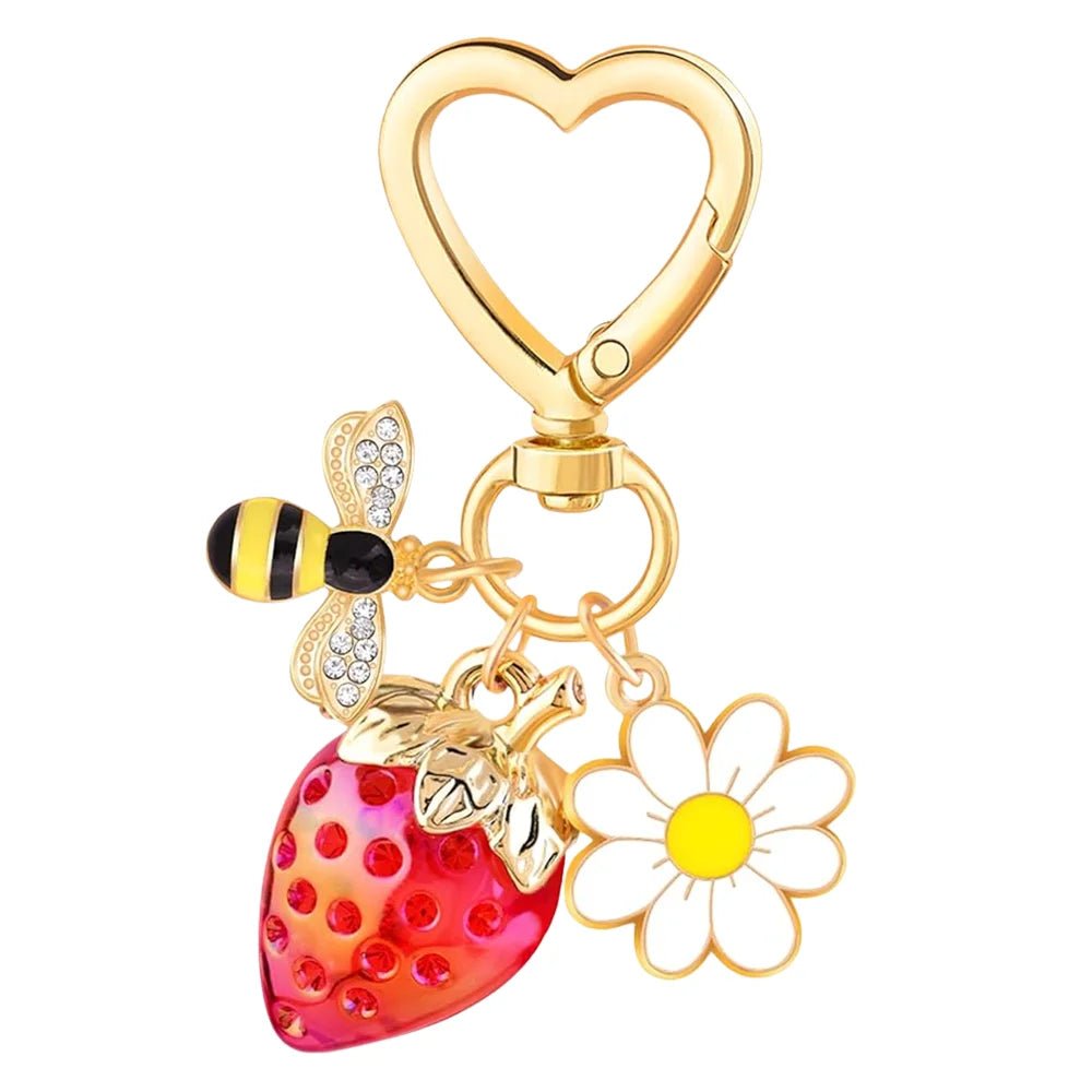Gold Keychain with heart-shaped clasp, red strawberry, diamante bee, and flower charm
