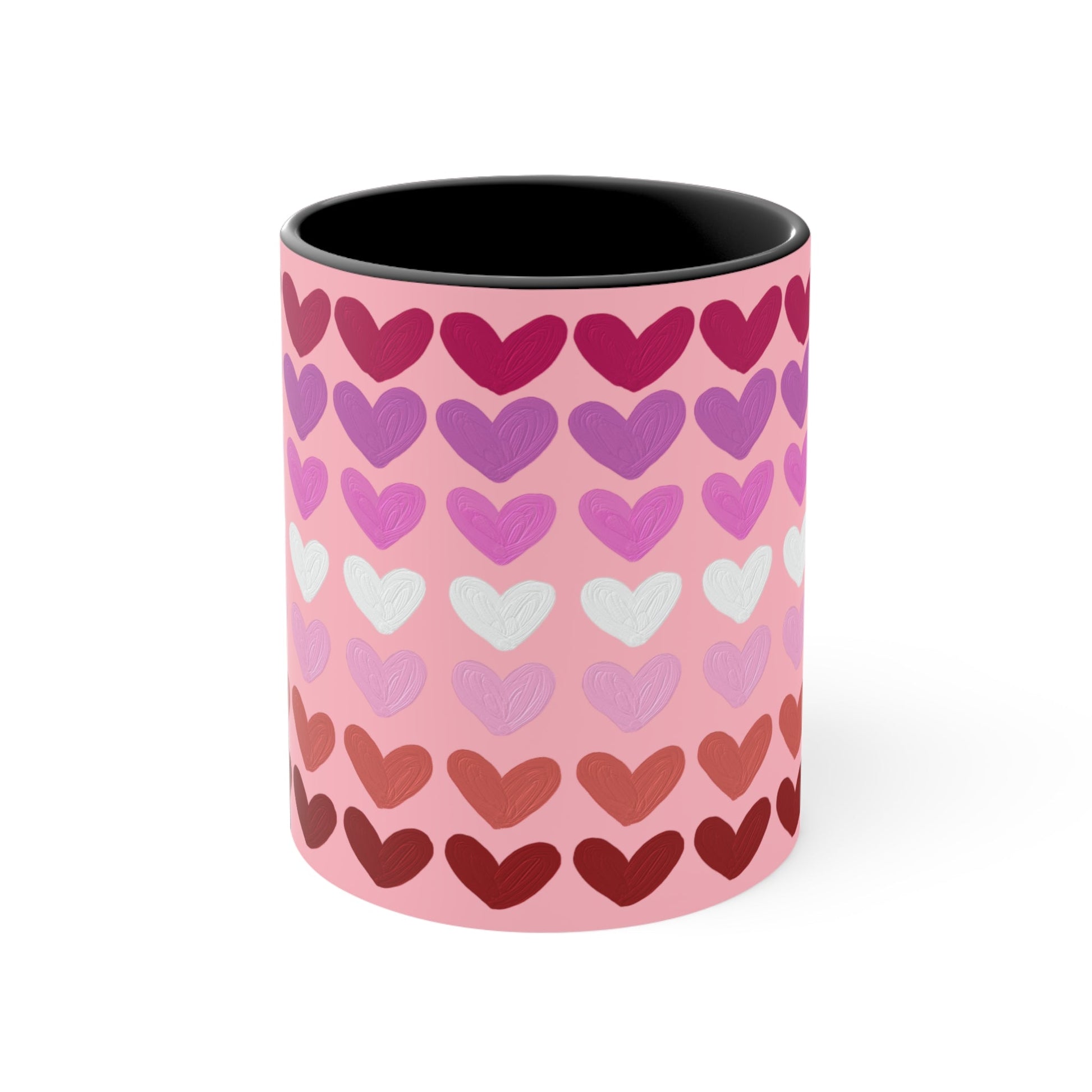 The "Subtle Lesbian Pride Flag - love hearts - colourful accent mug" by Printify is a white ceramic mug with a vibrant interior and red handle, adorned with heart patterns in various shades of pink, purple, and red. The hearts are arranged in horizontal rows, gradually transitioning from lighter shades at the top to darker ones at the bottom.