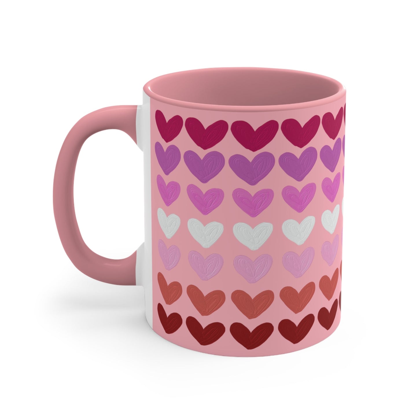 The "Subtle Lesbian Pride Flag - love hearts - colourful accent mug" by Printify is a white ceramic mug with a vibrant interior and red handle, adorned with heart patterns in various shades of pink, purple, and red. The hearts are arranged in horizontal rows, gradually transitioning from lighter shades at the top to darker ones at the bottom.