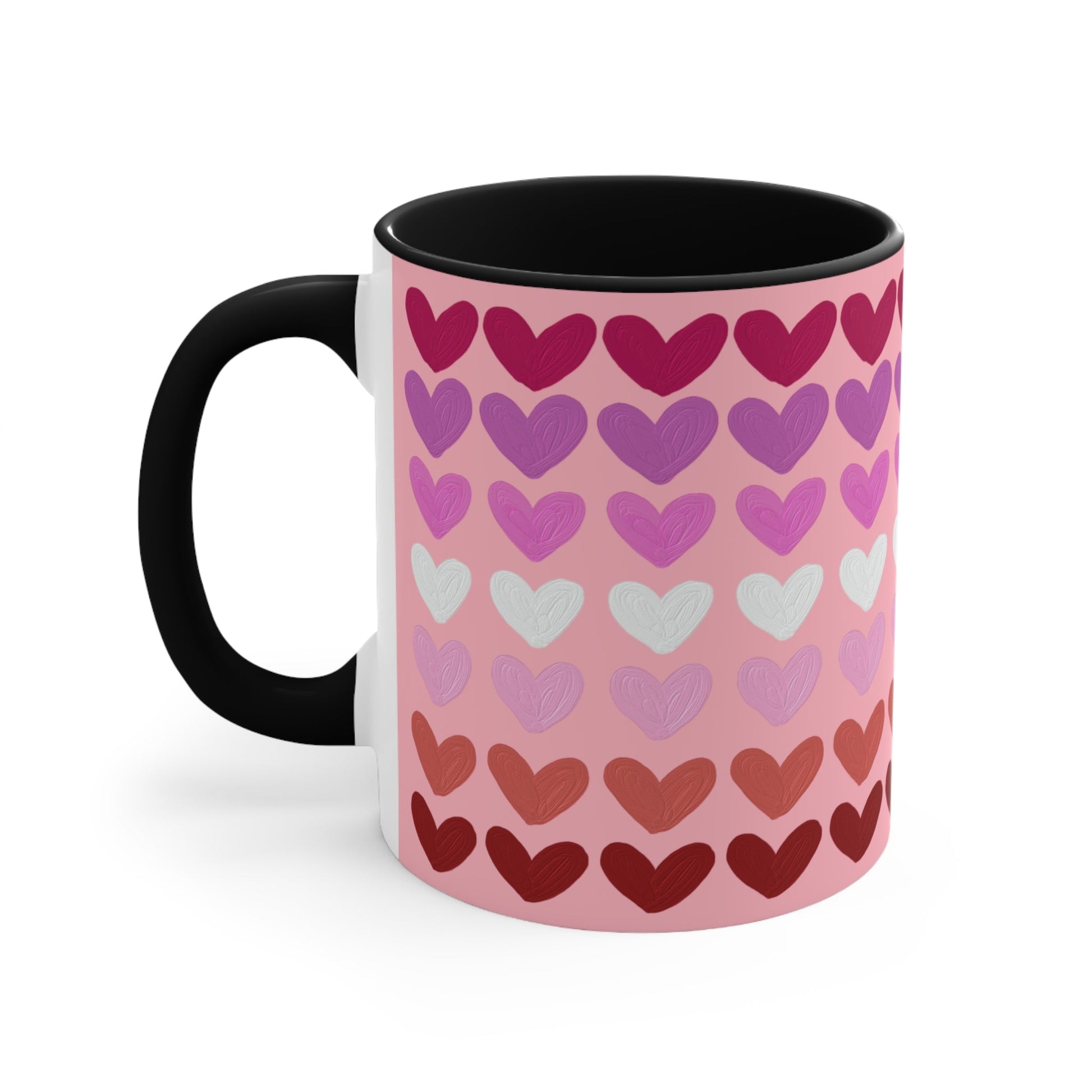 The "Subtle Lesbian Pride Flag - love hearts - colourful accent mug" by Printify is a white ceramic mug with a vibrant interior and red handle, adorned with heart patterns in various shades of pink, purple, and red. The hearts are arranged in horizontal rows, gradually transitioning from lighter shades at the top to darker ones at the bottom.