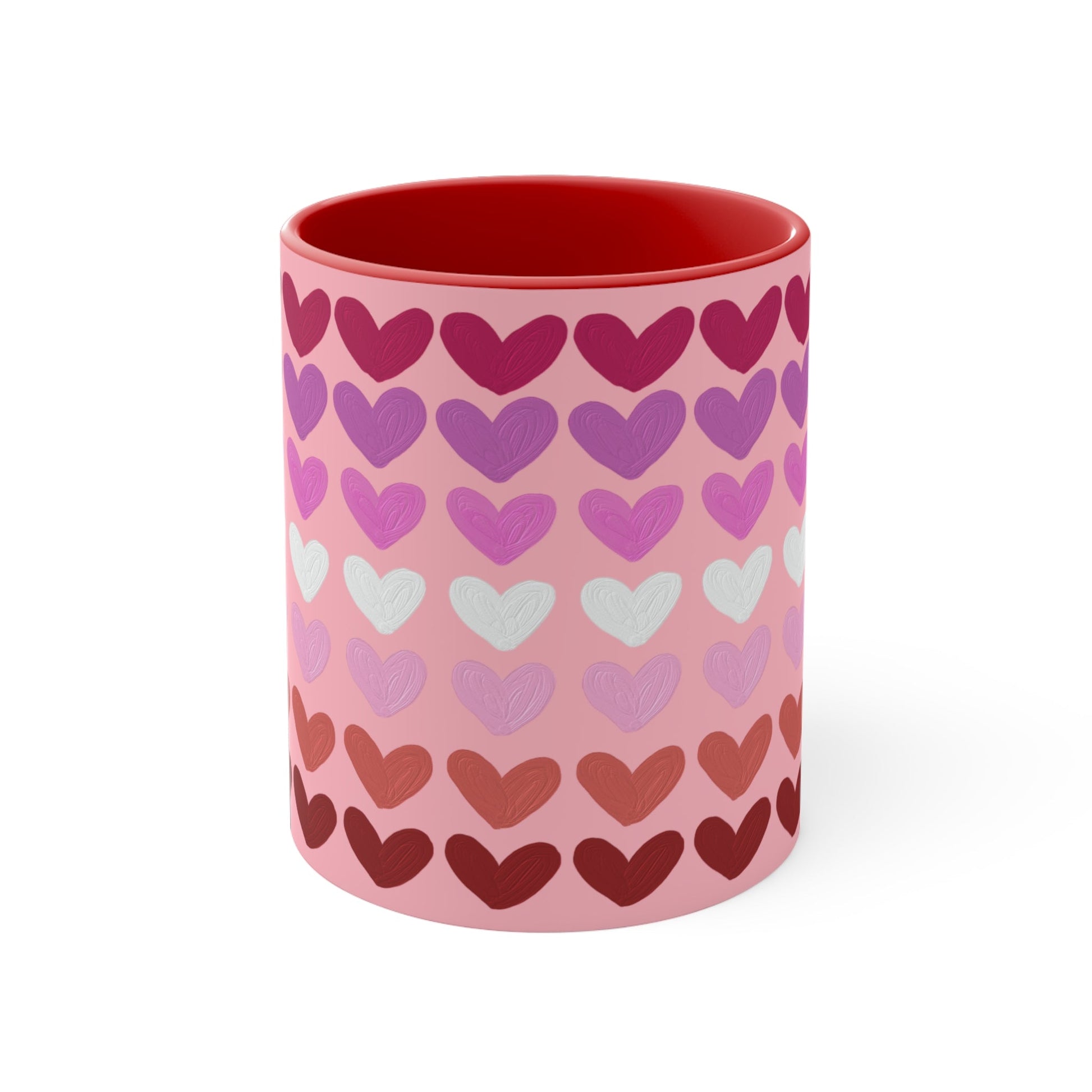 The "Subtle Lesbian Pride Flag - love hearts - colourful accent mug" by Printify is a white ceramic mug with a vibrant interior and red handle, adorned with heart patterns in various shades of pink, purple, and red. The hearts are arranged in horizontal rows, gradually transitioning from lighter shades at the top to darker ones at the bottom.