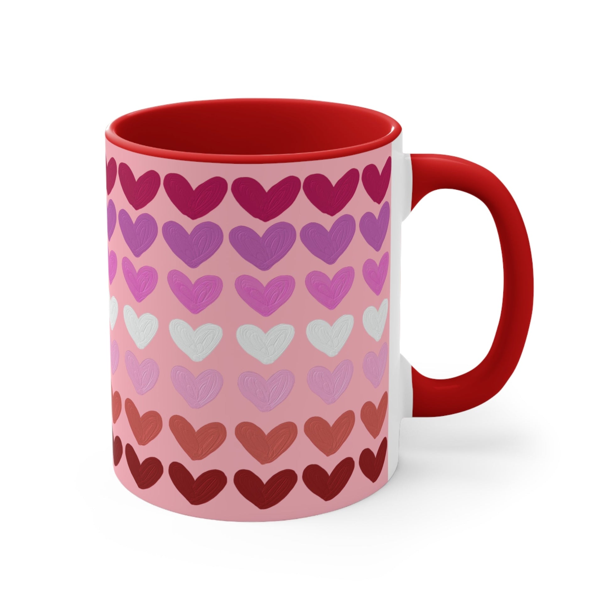 The "Subtle Lesbian Pride Flag - love hearts - colourful accent mug" by Printify is a white ceramic mug with a vibrant interior and red handle, adorned with heart patterns in various shades of pink, purple, and red. The hearts are arranged in horizontal rows, gradually transitioning from lighter shades at the top to darker ones at the bottom.