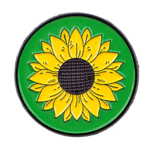 Round green badge with a yellow sunflower representing hidden disability, chronic illness, mental illness or neurodiveristy