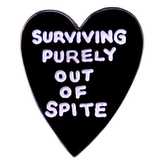 The Surviving Purely Out of Spite black love heart badge features white text on a bold, enamel pin—perfect for your collection or pride items. Ready to ship fast with our trusted accessories delivery.