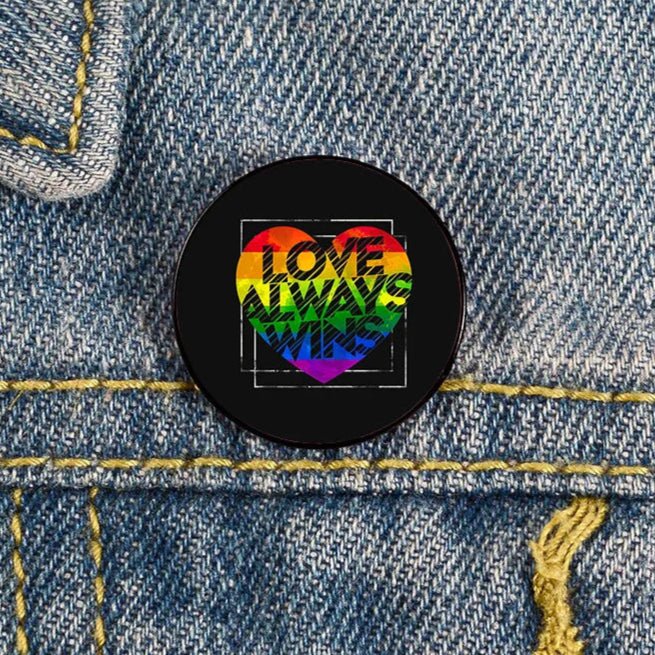 The Future Is Inclusive Pin in a range of pride flags