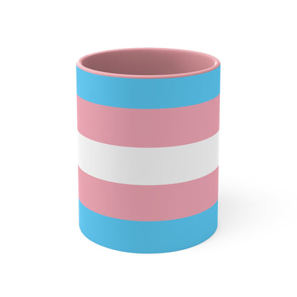 The Trans Pride Flag Colourful Accent Mug by Printify features a ceramic design with horizontal stripes in blue, pink, and white. Its solid blue handle perfectly complements the colorful interior.