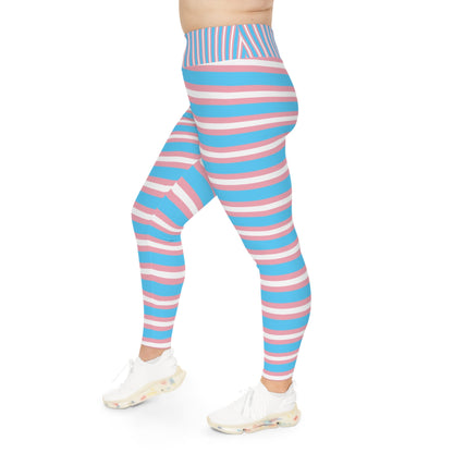 A person is modeling vibrant Trans Pride Plus Size Leggings (available in sizes 2XL - 6XL), featuring horizontal stripes in blue, pink, and white to represent transgender pride. The leggings are coordinated with white sneakers against a plain white background. The image focuses solely on the lower body, excluding the upper body and face.