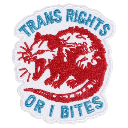 Patch with red possum design and text 'TRANS RIGHTS OR I BITES' on a white background