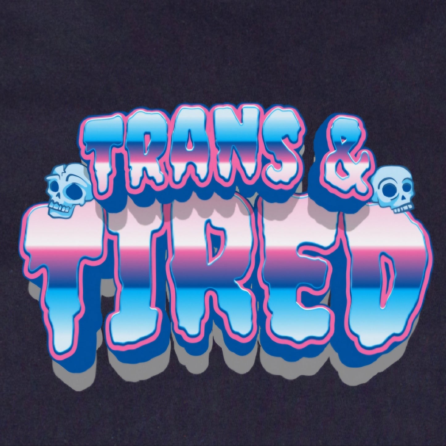The Trans & Tired - Local hand printed t-shirt features "TRANS & TIRED" in bold, 3D letters with blue, pink, and white stripes plus two cartoon skulls on a black background inspired by the transgender pride flag.