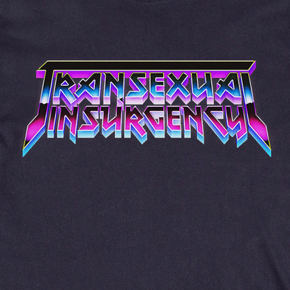 The image displays "Transexual Insurgency" in bold, angular, purple and blue gradient metallic letters on a dark backdrop, as featured on the locally hand printed Transexual Insurgency t-shirt.