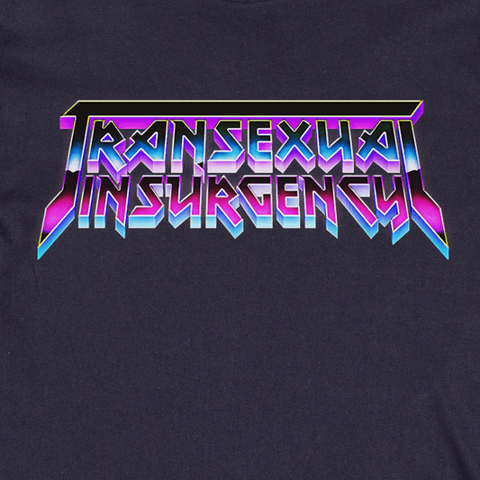 The image displays "Transexual Insurgency" in bold, angular, purple and blue gradient metallic letters on a dark backdrop, as featured on the locally hand printed Transexual Insurgency t-shirt.