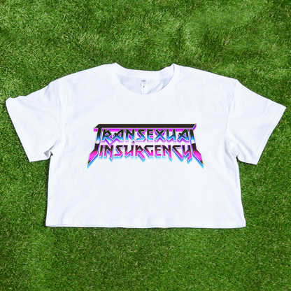 White crop tee with 'Transsexual Insurgency' text on a grass background