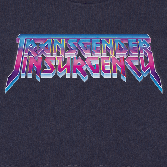 The image shows the "Transgender Insurgency and Transexual Insurgency" logo in bold, colorful, metallic letters on a dark background—featured on a locally hand-printed fundraising t-shirt.