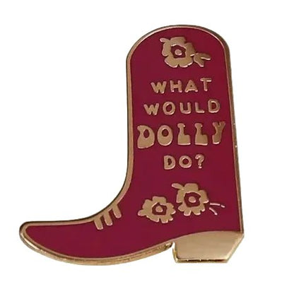 A dark red cowboy boot pin with gold lettering reading 'WHAT WOULD DOLLY DO?'