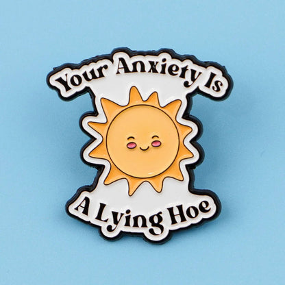 Pin with sun design and text 'Your Anxiety Is A Lying Hoe' 