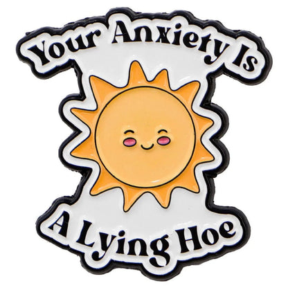 Enamel pin with a sun design and text 'Your Anxiety Is A Lying Hoe' on a white background